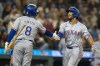 Texas Rangers' Marcus Semien, right, celebrates with Josh Smith after hitting a two-run home run during the fifth inning of a baseball game against the Seattle Mariners, Saturday, Sept. 14, 2024, in Seattle. (AP Photo/Stephen Brashear)