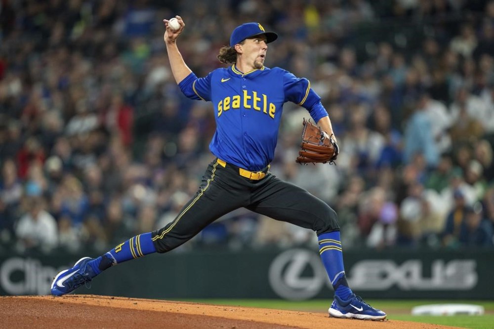 Seattle Mariners starter Logan Gilbert delivers a pitch during the first inning of a baseball game against the Texas Rangers, Saturday, Sept. 14, 2024, in Seattle. (AP Photo/Stephen Brashear)