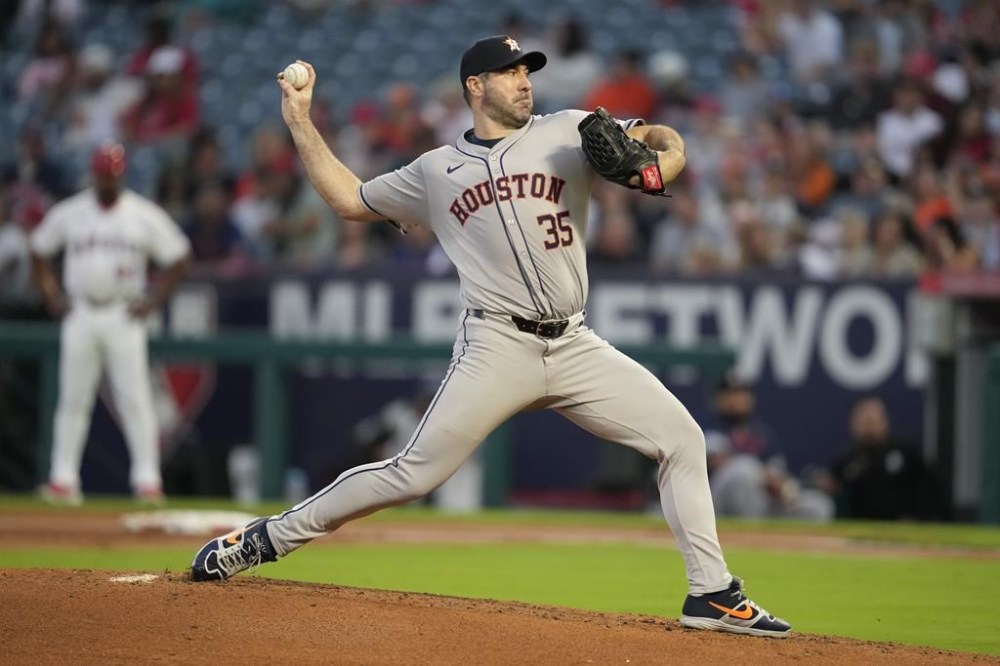 Houston Astros starting pitcher Justin Verlander throws during the first inning of a baseball game against the Los Angeles Angels in Anaheim, Calif., Saturday, Sept. 14, 2024. (AP Photo/Ashley Landis)