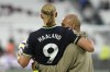 Manchester City's head coach Pep Guardiola hugs Manchester City's Erling Haaland at the end of the English Premier League soccer match between West Ham United and Manchester City at the London Stadium in London, England, Saturday, Aug. 31, 2024. (AP Photo/Frank Augstein)