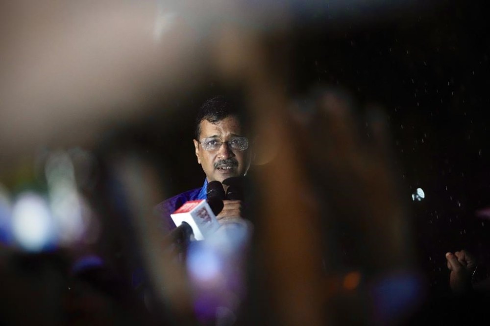 FILE - Aam Aadmi Party leader and Chief Minister of Delhi, Arvind Kejriwal, speaks to his followers in the rain as he comes out of Tihar prison after being granted bail by the country's highest court, in New Delhi, India, Friday, Sept. 13, 2024. (AP Photo/Manish Swarup, File)
