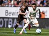 St. Pauli's Robert Wagner, left, and Augsburg's Ruben Vargas in action during the Bundesliga soccer match between FC Augsburg and FC St. Pauli at WWK-Arena, Augsburg, Germany, Sunday Sept. 15, 2024. (Harry Langer/dpa via AP)