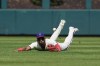 Philadelphia Phillies' Johan Rojas is unable to catch a ball hit by New York Mets' Francisco Lindor during the first inning of a baseball game, Sunday, Sept. 15, 2024, in Philadelphia. (AP Photo/Derik Hamilton)