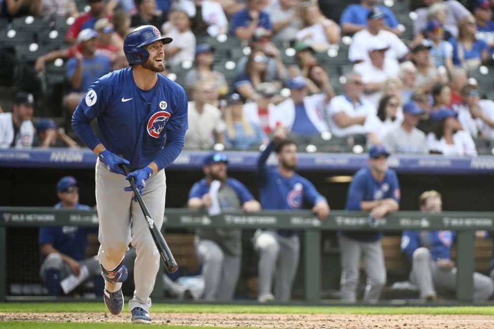 Chicago Cubs' Michael Busch reacts after hitting a one-run home run in the ninth inning of a baseball game against the Colorado Rockies, Sunday, Sept. 15, 2024, in Denver. (AP Photo/Geneva Heffernan)