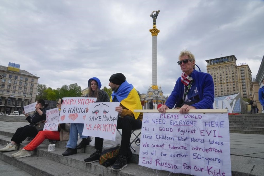 Ryan Wesley Routh, right, takes part in a rally in central Kyiv, Ukraine, Saturday, April 30, 2022. (AP Photo/Efrem Lukatsky)