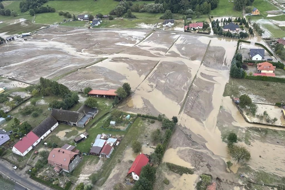 This handout photo provided by the Polish fire department, shows a flooded area near the Nysa Klodzka river in Nysa, Poland on Monday, Sept. 16, 2024. (KG PSP Photo via AP)