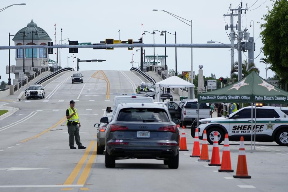A Palm Beach County Sheriff's officer works at a checkpoint near the bridge that leads to the Mar-a-Lago estate after the apparent assassination attempt of Republican presidential nominee and former President Donald Trump Monday, Sept. 16, 2024, in West Palm Beach, Fla. (AP Photo/Lynne Sladky)