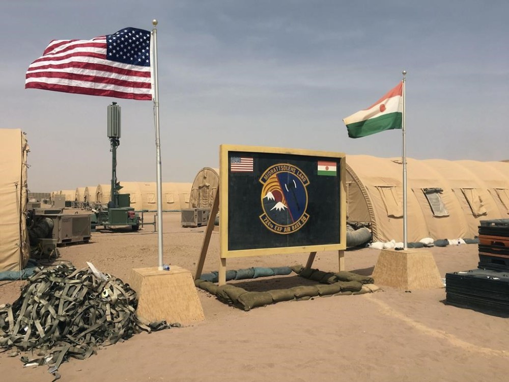 FILE - U.S. and Niger flags fly at the Niger Air Base 201 in Agadez, Niger, April 16, 2018. (AP Photo/Carley Petesch, File)