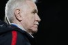 FILE - New Zealand coach Tom Sermanni listens to national anthems prior to the Algarve Cup semifinal women's soccer match between New Zealand and Italy at the Bela Vista stadium, in Parchal, Portugal, March 7, 2020. (AP Photo/Armando Franca, File)