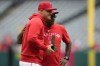 Los Angeles Angels' Mike Trout, left, is recognized as the Angels' 2024 Roberto Clemente Award nominee before a baseball game against the Houston Astros in Anaheim, Calif., Sunday, Sept. 15, 2024. At right is manager Ron Washington. (AP Photo/Ashley Landis)