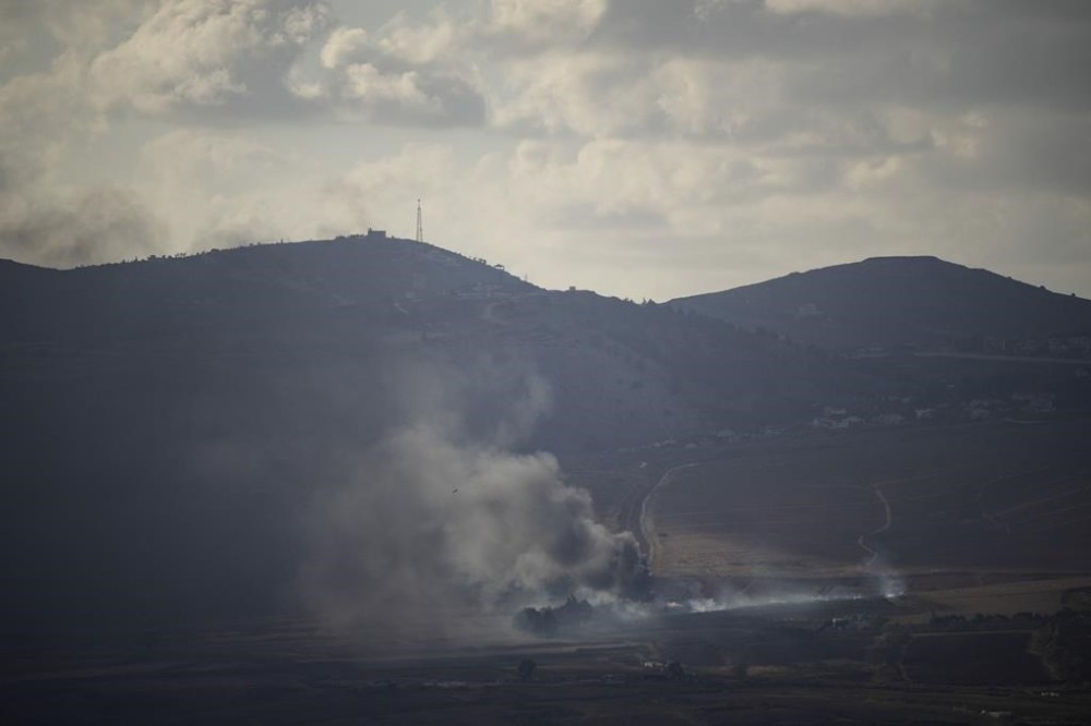 Smoke rises after an Israeli shelling on an area in Lebanon, seen from the Israel-annexed Golan Heights, next to the Israeli-Lebanese border, Monday, Sept. 16, 2024. (AP Photo/Leo Correa)