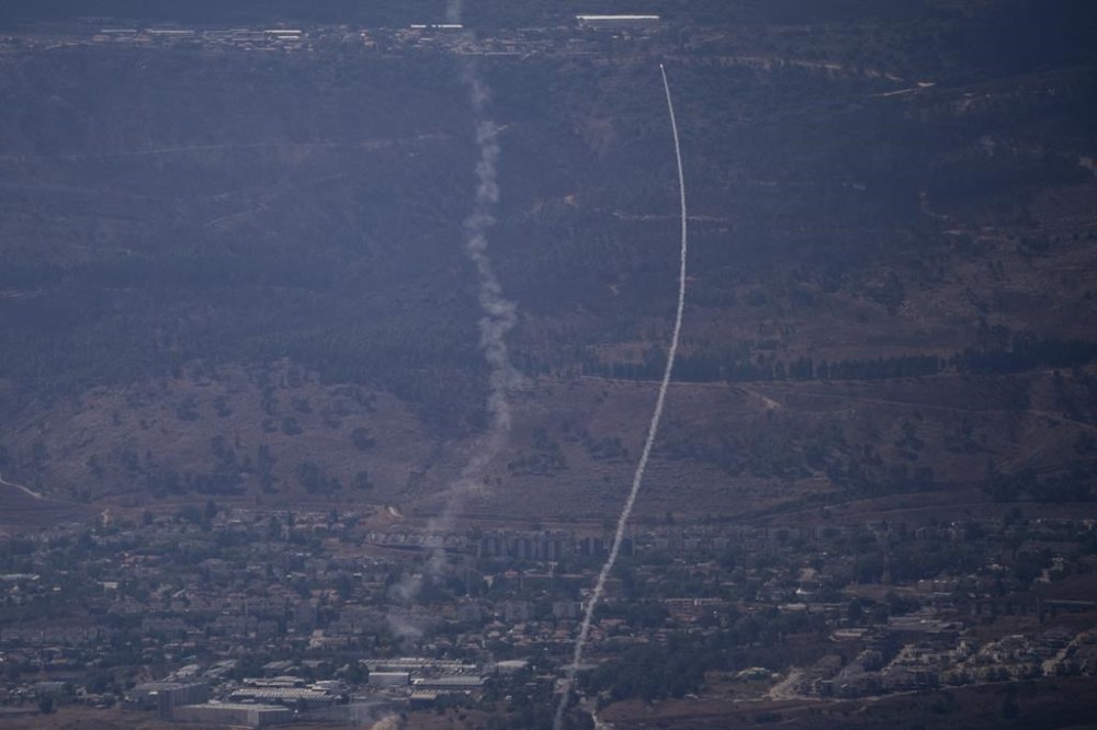 The Israeli Iron Dome air defense system fires to intercept an attack from Lebanon over the Galilee region, near Kiryat Shmona, as seen from the Israeli-annexed Golan Heights, Tuesday, Sept. 17, 2024. (AP Photo/Leo Correa)