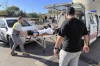 Civil Defense first-responders carry a wounded man whose handheld pager exploded at al-Zahraa hospital in Beirut, Lebanon, Tuesday, Sept. 17, 2024. (AP Photo/Hussein Malla)