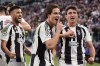 Juventus' Kenan Yildiz, center, celebrates after scoring the opening goal during the Champions League opening phase soccer match between Juventus and PSV Eindhoven at the Juventus stadium in Turin, Italy, Tuesday, Sept. 17, 2024. (Fabio Ferrari/LaPresse via AP)