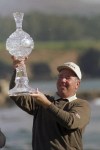 FILE - Mark O'Meara holds aloft the trophy after winning the AT&T Pebble Beach National Pro Am, Sunday, Feb. 2, 1997, at Pebble beach Golf Course. (AP Photo/Bob Galbraith, Fil)