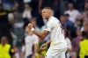 Real Madrid's Kylian Mbappe celebrates after scoring the opening goal during the Champions League opening phase soccer match between Real Madrid and VfB Stuttgart at the Santiago Bernabeu stadium, in Madrid, Tuesday, Sept. 17, 2024. (AP Photo/Manu Fernandez)