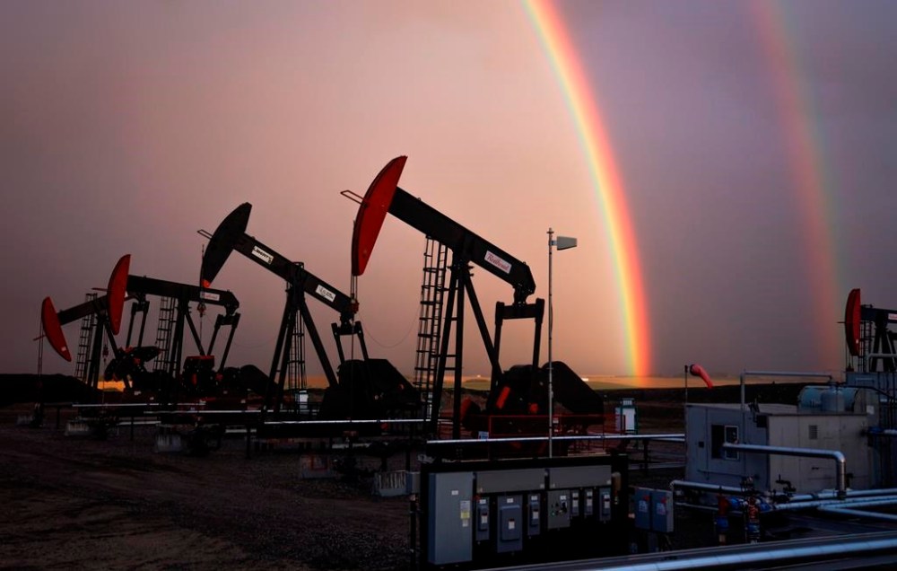 A rainbow appears to come down on pumpjacks drawing out oil and gas from wells near Calgary, Alta., Monday, Sept. 18, 2023. Observers are criticizing Alberta Energy Minister Brian Jean's suggestions on how the province might clean up its thousands of abandoned oil wells, saying they favour industry and lack input from the public. THE CANADIAN PRESS/Jeff McIntosh