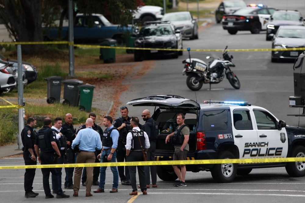 Saanich Police joined by Victoria Police and RCMP respond gunfire involving multiple people and injuries reported at the Bank of Montreal during an active situation in Saanich, B.C., on Tuesday, June 28, 2022. THE CANADIAN PRESS/Chad Hipolito