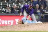 Colorado Rockies third baseman Ryan McMahon (24) tags out pinch-runner Brewer Hicklen for the final out of a baseball game Friday, Sept. 6, 2024, in Milwaukee. The Colorado Rockies won 3-2 over the Milwaukee Brewers. (AP Photo/Kayla Wolf)