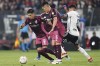 Maximiliano Meza of Argentina's River Plate, left, and Esteban Pavez of Chile's Colo Colo, right, battle for the ball during a Copa Libertadores quarterfinal first leg soccer match in Santiago, Chile, Tuesday, Sept. 17, 2024. (AP Photo/Luis Hidalgo)