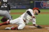 Los Angeles Angels' Charles Leblanc, right, scores on a single by Taylor Ward as Chicago White Sox catcher Korey Lee waits for the ball during the third inning of a baseball game, Tuesday, Sept. 17, 2024, in Anaheim, Calif. (AP Photo/Mark J. Terrill)