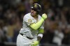 San Diego Padres' Manny Machado celebrates after hitting a two-run home run during the sixth inning of a baseball game against the Houston Astros, Tuesday, Sept. 17, 2024, in San Diego. (AP Photo/Gregory Bull)