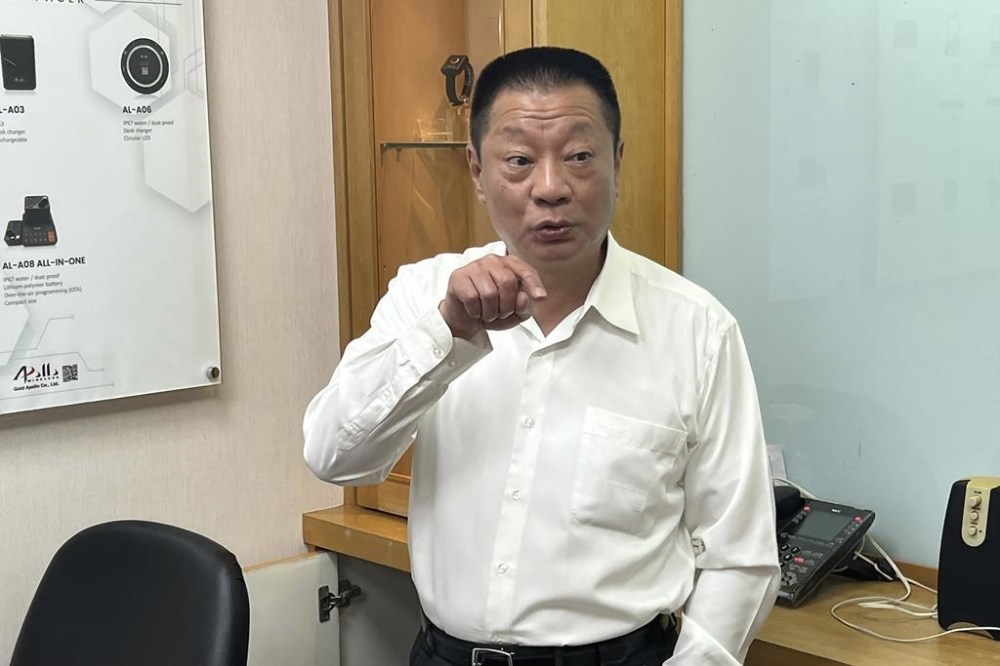 Hsu Ching-kuang, chairman of Apollo Gold, talks about the Taiwan company's communication products at the headquarters in New Taipei City, Taiwan Wednesday, Sept. 18, 2024. (AP Photo/Johnson Lai)