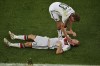 FILE - Germany's Christoph Kramer lies on the pitch as teammate Thomas Mueller assists him, during the World Cup final soccer match between Germany and Argentina at the Maracana Stadium in Rio de Janeiro, Brazil, on July 13, 2014. (AP Photo/Francois Xavier Marit, Pool, File)