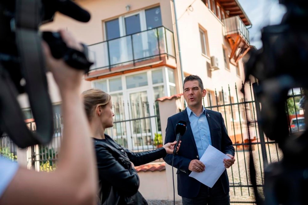 Előd Novak, a member of the National Assembly of Hungary, talks to the local media in front of a house where a Hungarian company that allegedly manufactured pagers that exploded in Lebanon and Syria, is headquartered in Budapest Wednesday, Sept. 18, 2024. (AP Photo/Denes Erdos)
