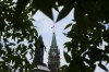 The Liberal government says it is further cutting the number of permits it issues to international students who come to Canada to study. The Peace Tower on Parliament Hill is framed by leaves in Ottawa on Tuesday, Aug. 27, 2024. THE CANADIAN PRESS/Sean Kilpatrick
