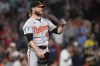 Baltimore Orioles pitcher Craig Kimbrel reacts after giving up a two-run double to Boston Red Sox's Ceddanne Rafaela during the seventh inning of a baseball game at Fenway Park, Monday, Sept. 9, 2024, in Boston. (AP Photo/Charles Krupa)