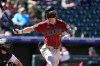 Arizona Diamondbacks' Corbin Carroll follows the flight of his solo home run off Colorado Rockies starting pitcher Austin Gomber in the first inning of a baseball game Wednesday, Sept. 18, 2024, in Denver. (AP Photo/David Zalubowski)