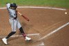 Minnesota Twins shortstop Carlos Correa hits an RBI single during the fifth inning of a baseball game against the Cleveland Guardians, Wednesday, Sept. 18, 2024, in Cleveland. Willi Castro scored on the play.(AP Photo/David Dermer)