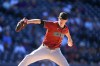 Arizona Diamondbacks relief pitcher Joe Mantiply works against the Colorado Rockies in the ninth inning of a baseball game Wednesday, Sept. 18, 2024, in Denver. (AP Photo/David Zalubowski)