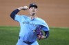 Toronto Blue Jays starting pitcher Bowden Francis throws to the Texas Rangers in the first inning of a baseball game in Arlington, Texas, Wednesday, Sept. 18, 2024. (AP Photo/Tony Gutierrez)