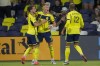 Nashville SC forward Sam Surridge (9) celebrates a goal with defender Daniel Lovitz, left, and forward Teal Bunbury (12) during the first half of an MLS soccer match against the Chicago Fire, Wednesday, Sept. 18, 2024, in Nashville, Tenn. (AP Photo/George Walker IV)