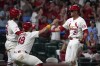 St. Louis Cardinals' Lars Nootbaar (21) celebrates with Ivan Herrera (48) and Brendan Donovan, left, after scoring on a three-run double by Jordan Walker during the seventh inning of a baseball game against the Pittsburgh Pirates Wednesday, Sept. 18, 2024, in St. Louis. (AP Photo/Jeff Roberson)
