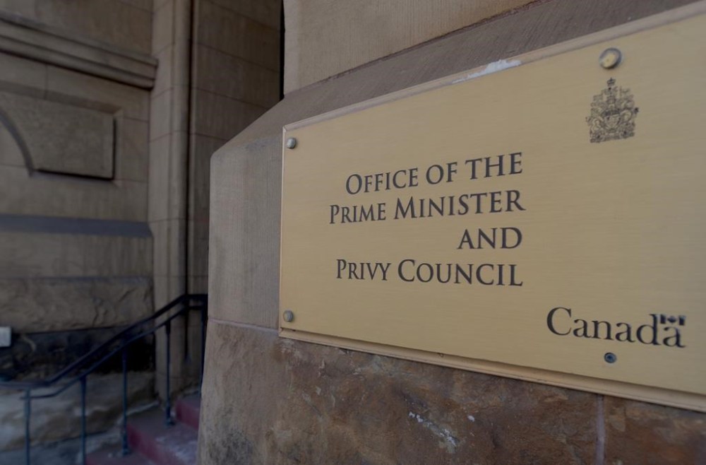 The main door to the Office of the Prime Minister and Privy Council Office is seen in Ottawa on Feb. 18, 2019. Canada's senior public servant has invited his provincial and territorial counterparts to apply for top secret-level security clearance as a way of fostering