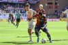 Genoa's Caleb Ekuban, left, and Roma's Paulo Dybala battle for the ball during the Serie A soccer match between Genoa and Roma at the Luigi Ferraris Stadium in Genoa, Italy, Sunday, Sept. 15, 2024. (Tano Pecoraro/LaPresse via AP)
