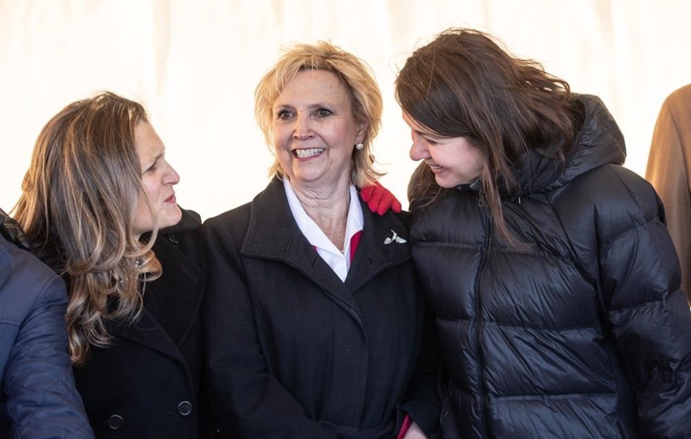 Deputy Prime Minister Chrystia Freeland, left, Fort Saskatchewan Mayor Gale Katchur , centre and Alberta Premier Danielle Smith chat at the Dow Chemical announcement, that will finalized plans to construct the world's first net-zero carbon emissions ethylene and derivatives complex, in Fort Saskatchewan Alberta, on Wednesday November 29, 2023. An Alberta mayor is apologizing after she mused about the