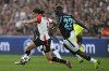 Feyenoord's Ramiz Zerrouki, left, and Leverkusen's Victor Boniface fight for the ball during the Champions League opening phase soccer match between Feyenoord and Leverkusen in Rotterdam, Netherlands, Thursday, Sept. 19, 2024. (AP Photo/Peter Dejong)