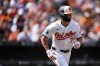 Baltimore Orioles' Jackson Holliday (7) advances toward first base after hitting a single to score two runs during the fourth inning of a baseball game against the San Francisco Giants, Thursday, Sept. 19, 2024, in Baltimore. (AP Photo/Stephanie Scarbrough)