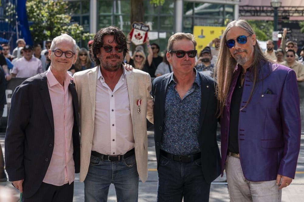 Johnny Fay, Paul Langlois, Gord Sinclair and Rob Baker (left to right) of The Tragically Hip stand for a photo at the Toronto International Film Festival, in Toronto, Thursday, Sept. 5, 2024. THE CANADIAN PRESS/Paige Taylor White