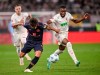 Mainz's Kaishu Sano is challenged by Augsburg's Jeffrey Gouweleeuw, left, and Frank Onyeka during the Bundesliga soccer match between FC Augsburg - FSV Mainz 05 at WWK-Arena, Augsburg, Germany, Friday Sept. 20, 2024. (Harry Langer/dpa via AP)
