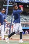 Atlanta Braves second baseman Ozzie Albies practices his swing during batting practice prior to the start of a baseball game against the Los Angeles Dodgers, Sunday, Sept. 15, 2024, in Atlanta. (AP Photo/Jason Allen)