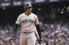 New York Yankees' Juan Soto walks back to the dugout after striking out against the Seattle Mariners during the first inning of a baseball game Thursday, Sept. 19, 2024, in Seattle. (AP Photo/Lindsey Wasson)