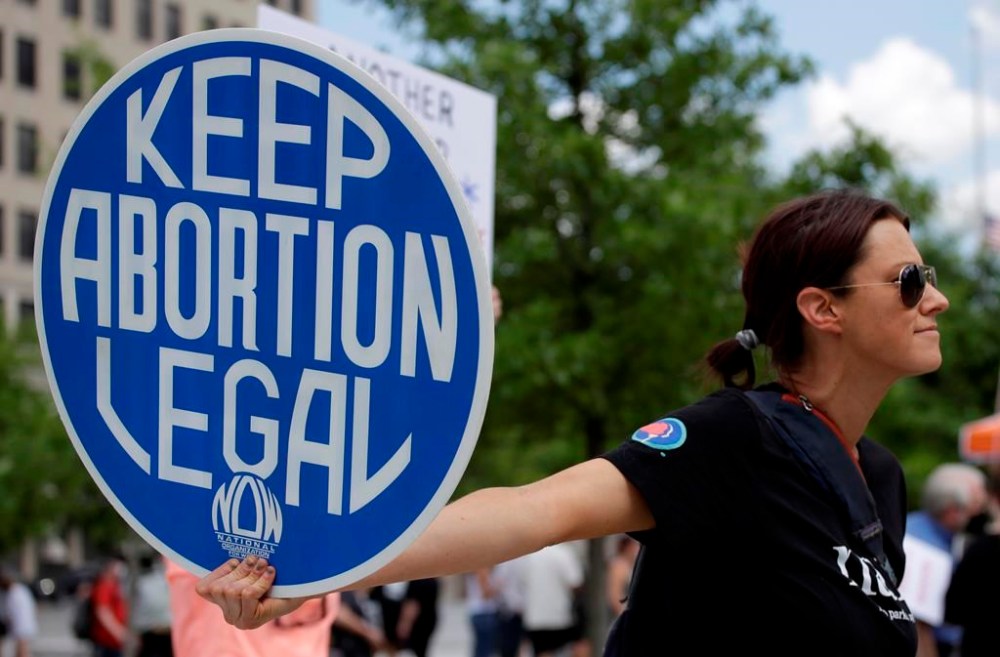 FILE - An. Abortion rights demonstrator holds a sign during a rally on May 14, 2022, in Chattanooga, Tenn. (AP Photo/Ben Margot, File)