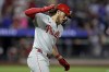 Philadelphia Phillies' Alec Bohm reacts after hitting a three-run home run during the fourth inning of a baseball game against the New York Mets Friday, Sept. 20, 2024, in New York. (AP Photo/Adam Hunger)