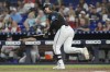 Miami Marlins' Jake Burger (36) hits a single to left field during the third inning of a baseball game against the Atlanta Braves, Friday, Sept. 20, 2024, in Miami. (AP Photo/Marta Lavandier)