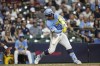Milwaukee Brewers' William Contreras hits a three-run home run during the fifth inning of a baseball game against the Arizona Diamondbacks, Friday, Sept. 20, 2024, in Milwaukee. (AP Photo/Jeffrey Phelps)